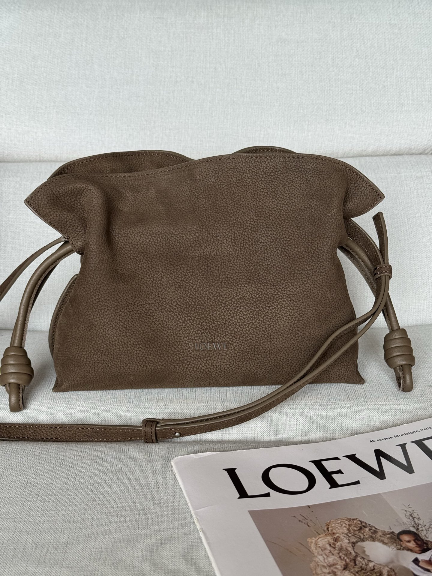 Small flamenco clutch in grained nubuck 11050s Flamenco clutch is crafted from soft materials for a slouchy style and has a drawstring accented with a historic knot