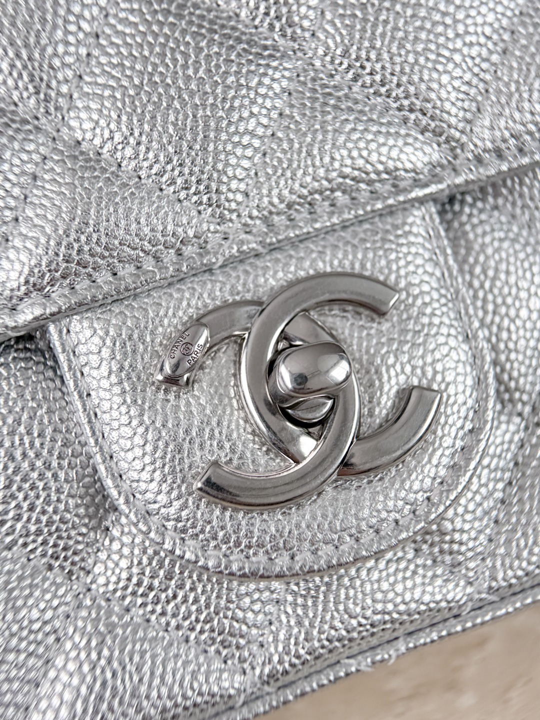 The silver metal chain and double C buckle give it a futuristic feel - Image 7