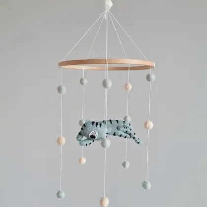 Minimalist felt mobile with pompoms and a tiger. Entirely handmade