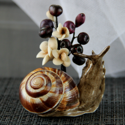 Flower arrangement with snail