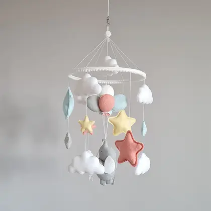 Multicolored baby mobile with elephant and balloons