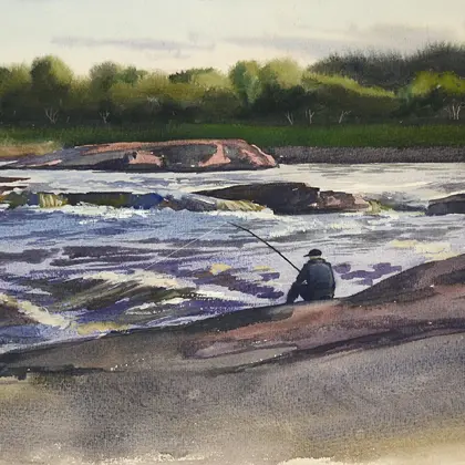 Salmon river. The fisherman catches fish sitting on the shore.