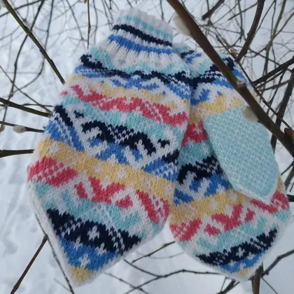 Women's hand-knitted wool mittens are very warm with a pattern