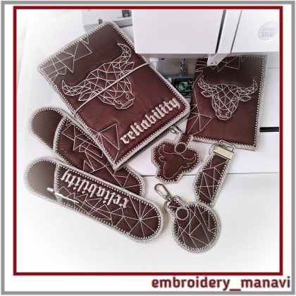 Taurus Reliability set with 8 ITH embroidery designs: quilted covers, pencil cases, and key fobs with geometric bull motifs by Embroidery Manavi 05.
