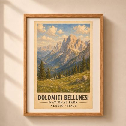Vertical framed art print of Dolomiti Bellunesi National Park featuring jagged limestone peaks, spruce forests, and wildflower meadow in a light oak frame on a neutral wall.