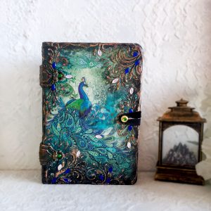 Decorative vintage Tarot card box in the form of a book for, or a deck of solitaire cards with an image of a Peacock. The box conveniently holds a deck of regular or playing cards