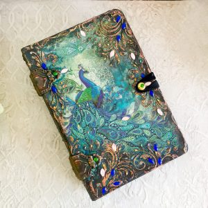 Decorative vintage Tarot card box in the form of a book for, or a deck of solitaire cards with an image of a Peacock. The box conveniently holds a deck of regular or playing cards