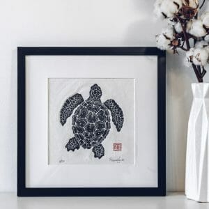 linocut print sea turtle with frame in interior