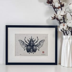 atlas beetle picture in frame on the wall