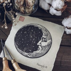 linocut print moon crescent black and white ink graphic