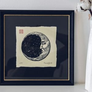 painting of moon crescent in a frame