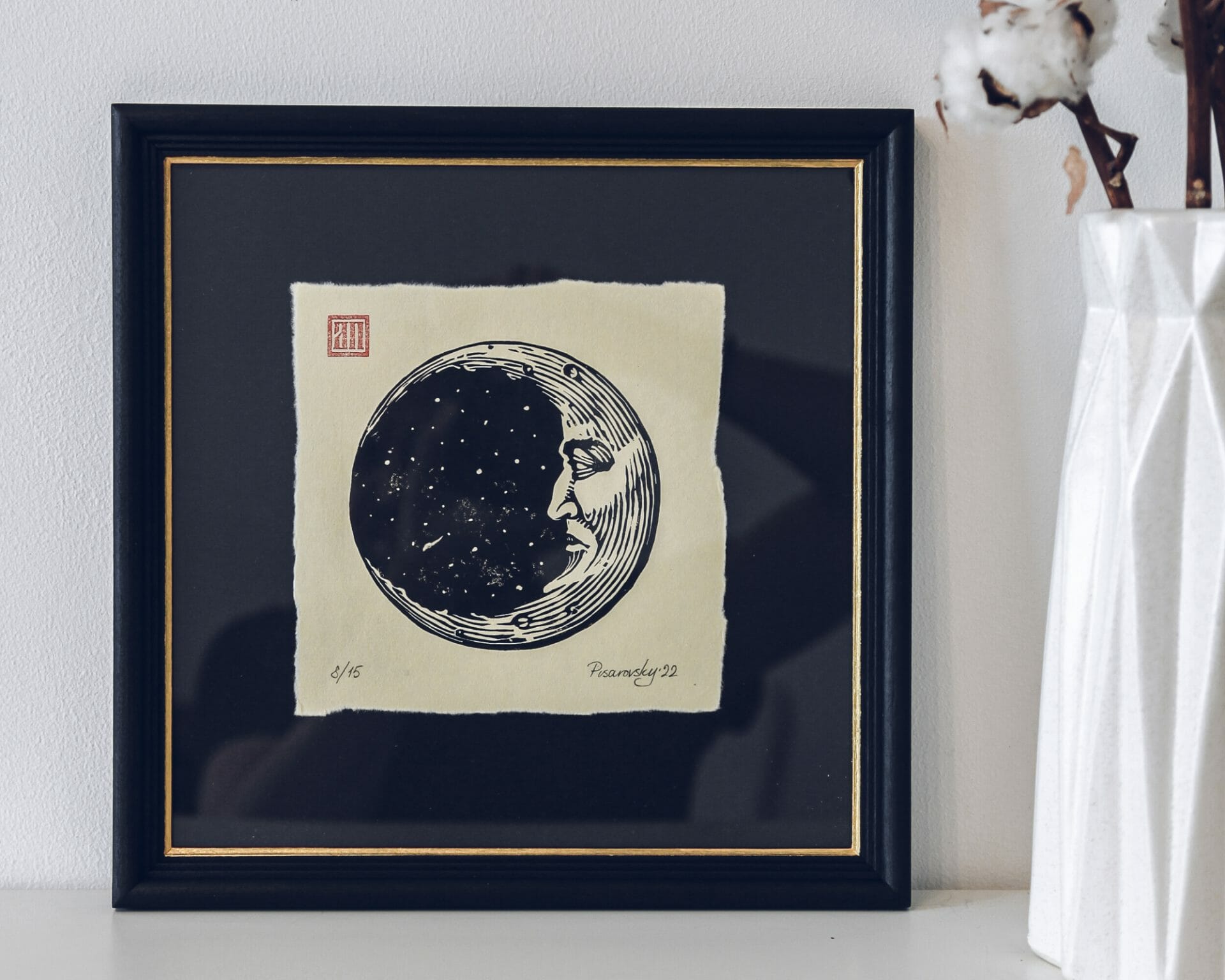 painting of moon crescent in a frame
