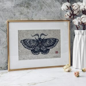 Linocut Night moth framed with passe-partout