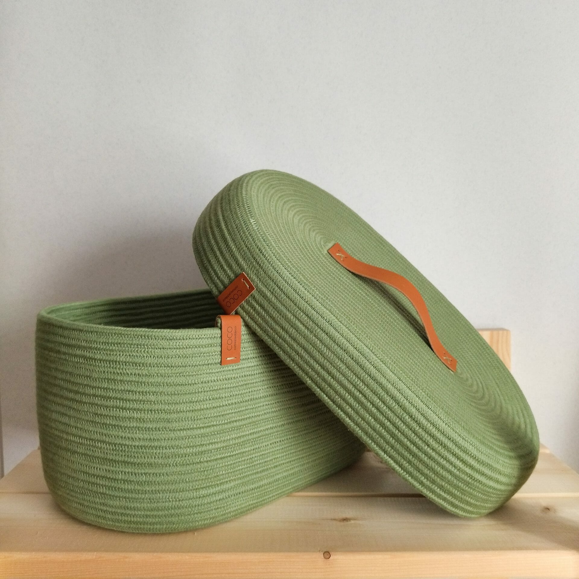 oval green rope basket with lid opened