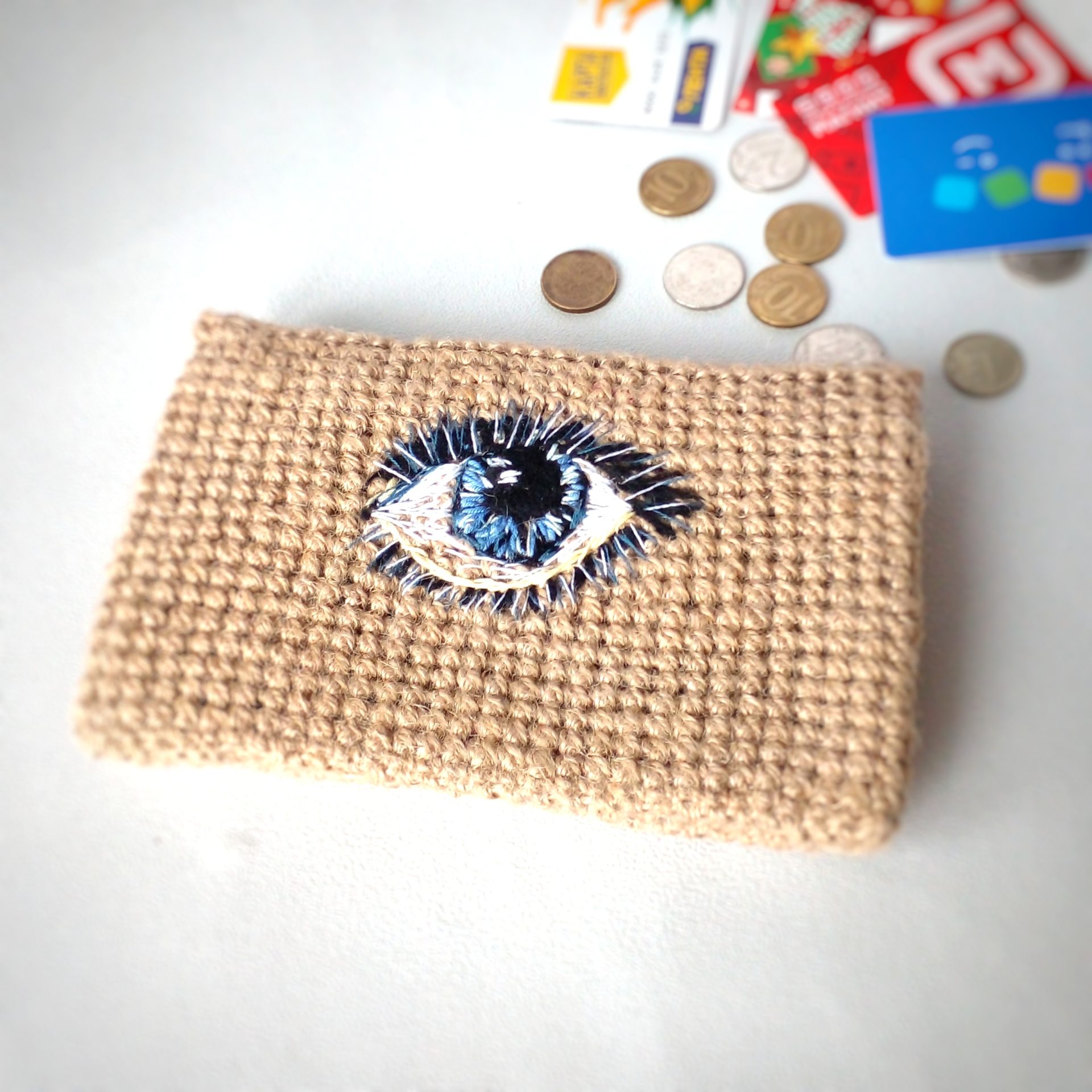 The wallet is crocheted from jute hand embroidery
