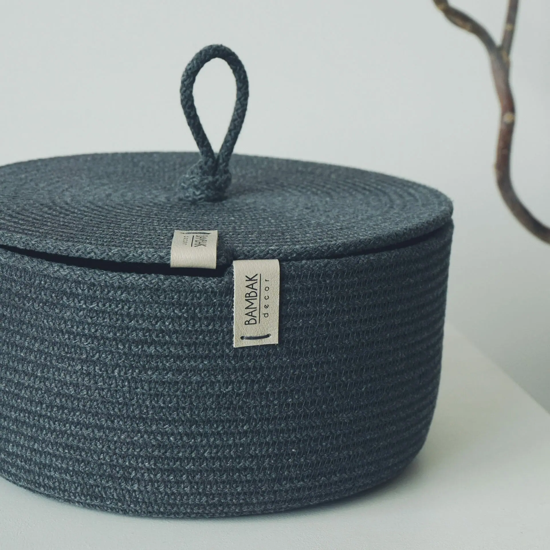 graphite rope basket with flat lid and handle close view