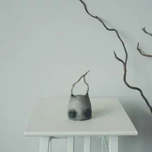 art sculpture stone head with branches