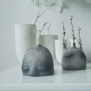 art sculptures stone head with drop and with leaves