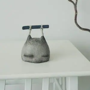 interior clay figurine stone head with rock
