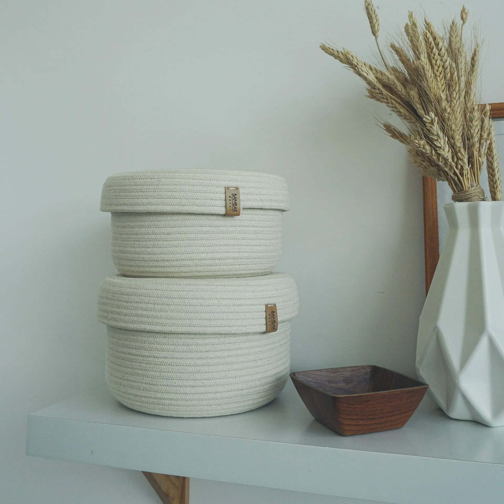 set of two white rope baskets with lid in kitchen