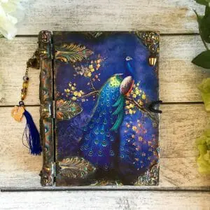Decorative vintage Tarot card box in the form of book for,or deck of solitaire cards with an image of Peacock.