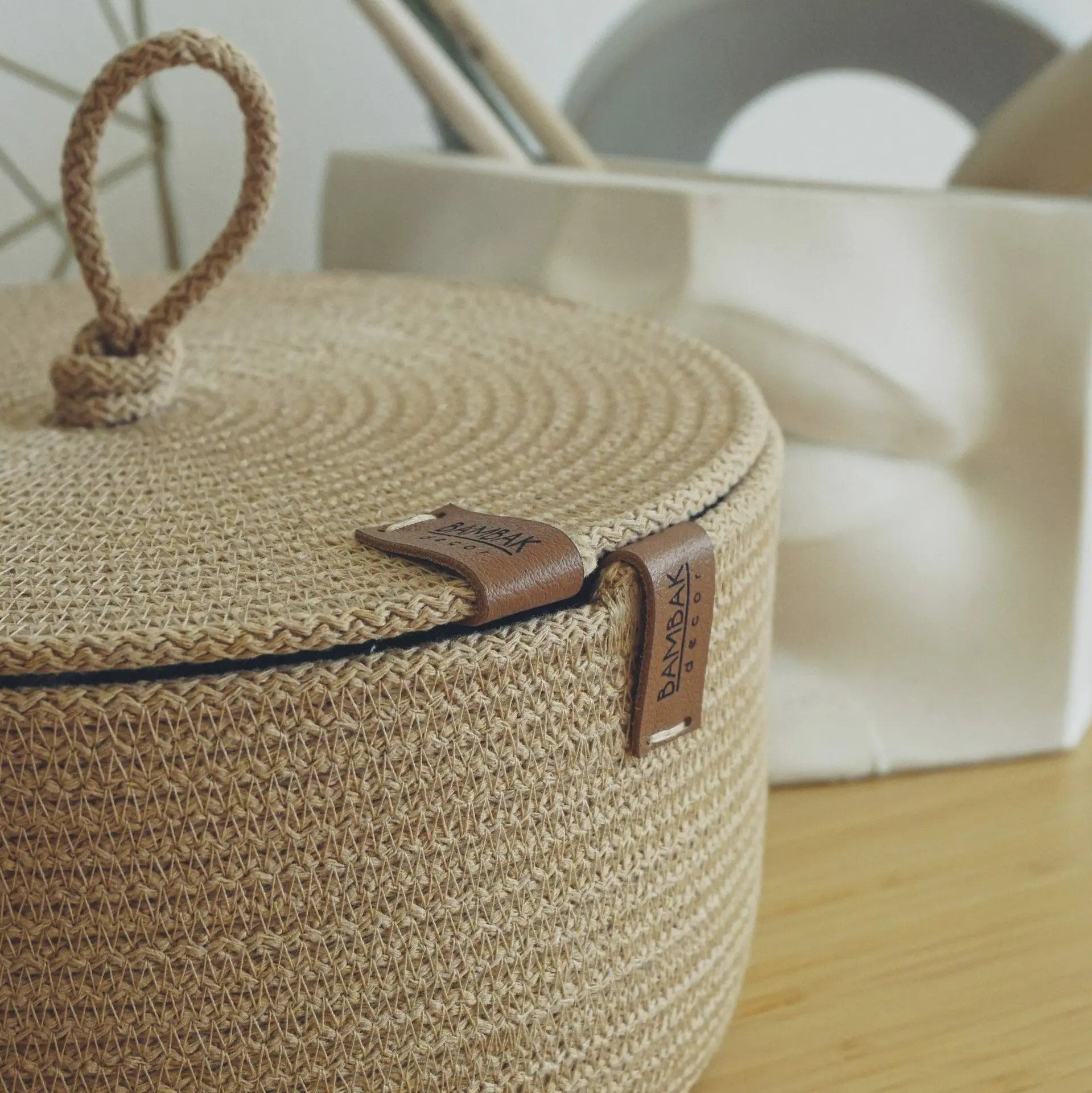 beige rope basket with flat lid close