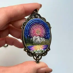 Seven Hour Sunset, landscape embroidery pendant