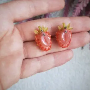 A pair of stud strawberry earrings, stainless steel