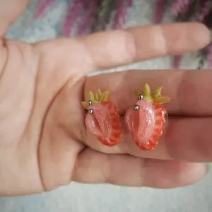 A pair of stud strawberry earrings, stainless steel