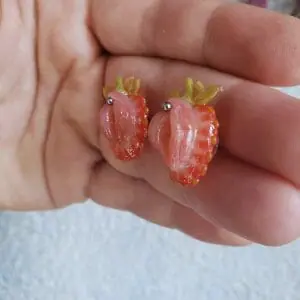 A pair of stud strawberry earrings, stainless steel