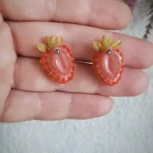 A pair of stud strawberry earrings, stainless steel