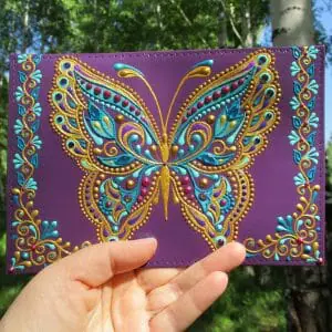 Hand-painted leather passport cover with butterfly.