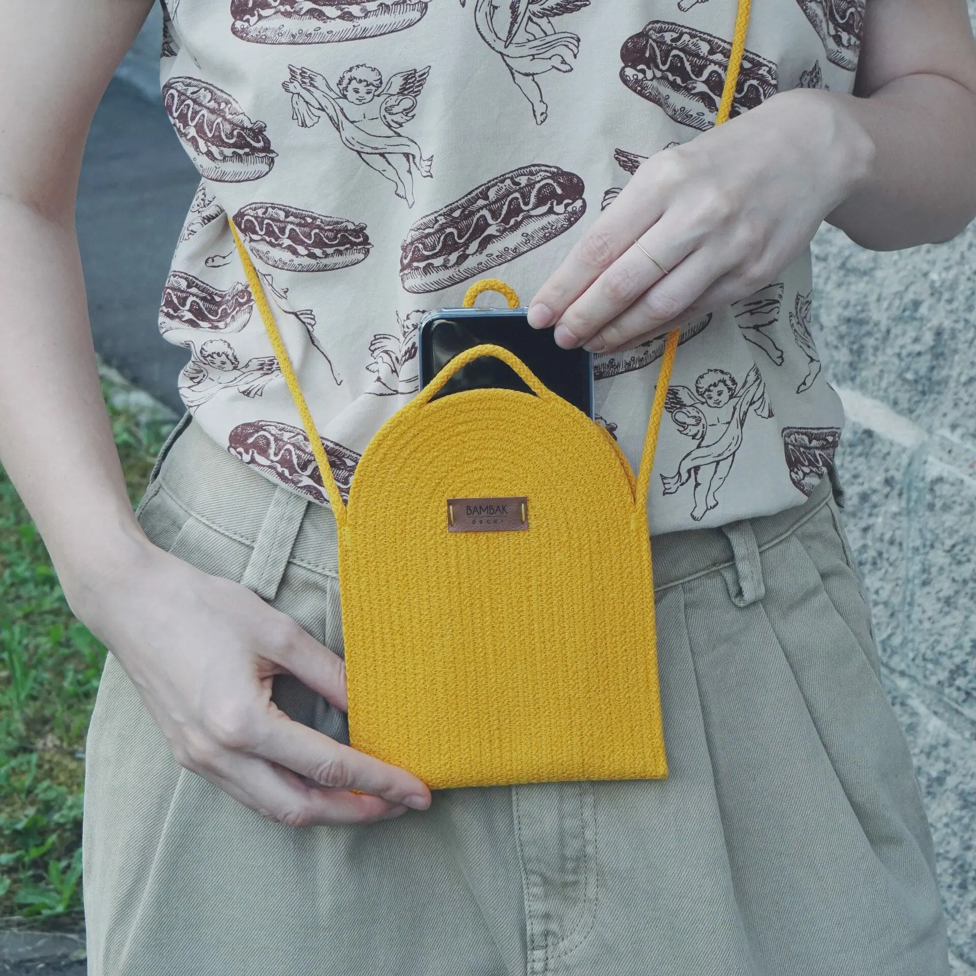 woman yellow cotton rope cross body bag for phone