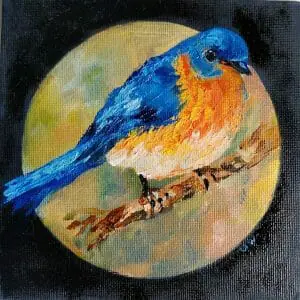 cute blue bird on a branch in a circle