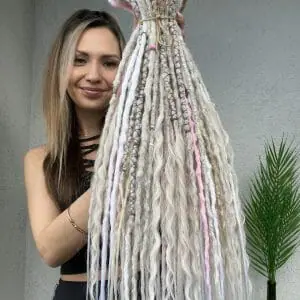 Light gray and pink dreads, cold blonde dreads and curls