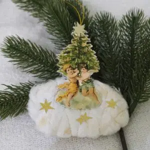 Christmas decoration in vintage style with angels near the Christmas tree
