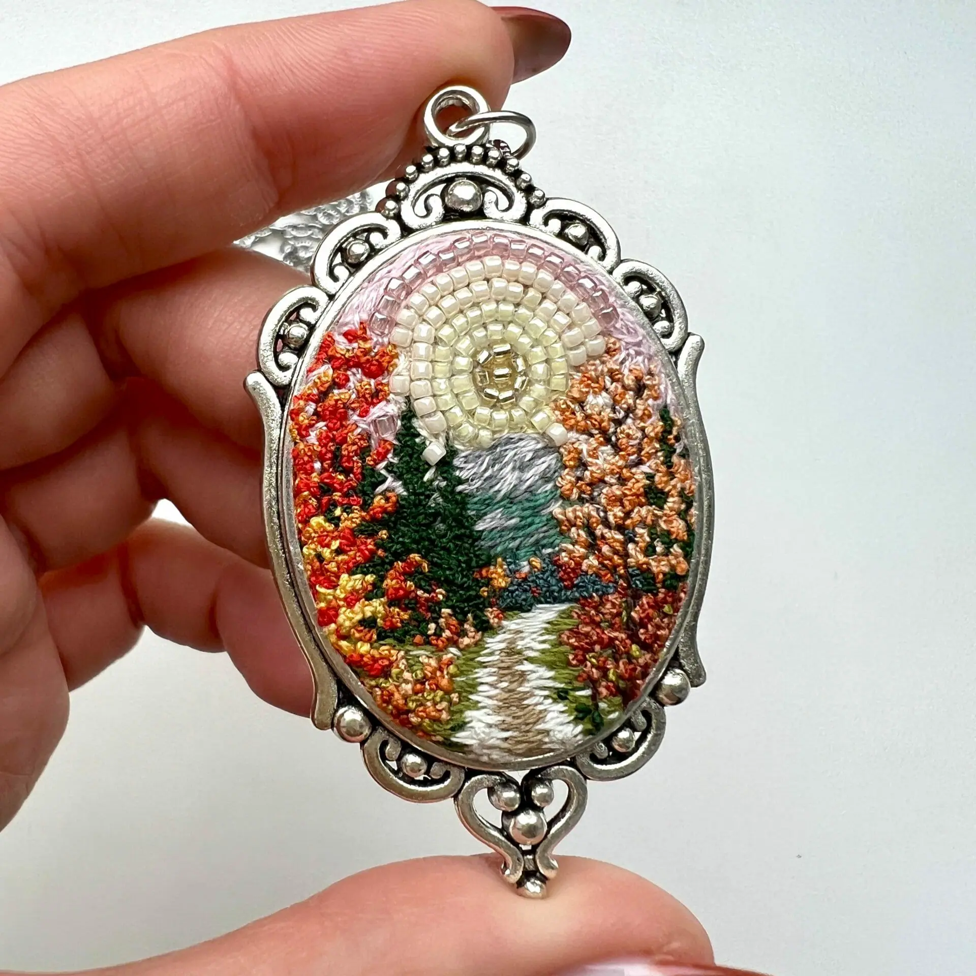 Transition, landscape embroidery pendant