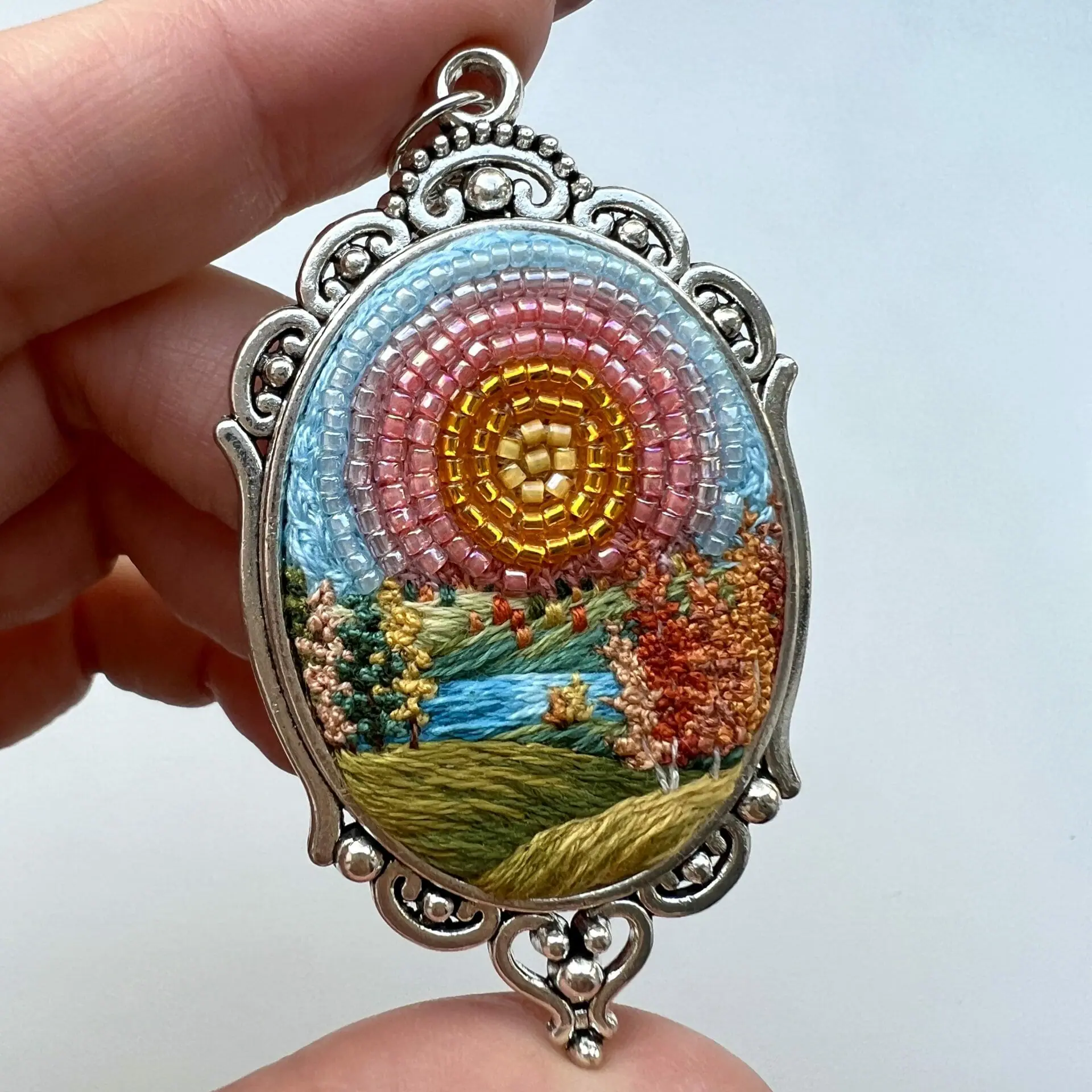 The Storm Has Passed, landscape embroidery pendant