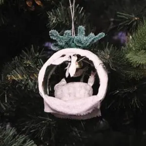 Christmas spun cotton toy cat with fish in the house