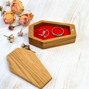wooden box in coffin shape with rings
