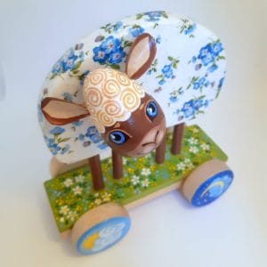 Easter lamb figurine is a vintage-style toy on wheels