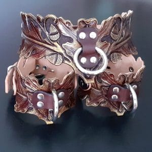 Custom leather bondage set collar and wrist cuffs in the shape of oak leaves