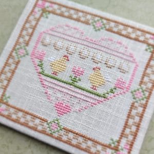 In the photo, cross-stitch Easter heart
