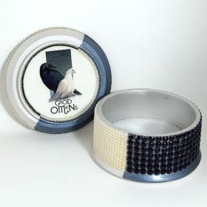 decor with characters from the TV series "Good omens" Round box in black and white.
