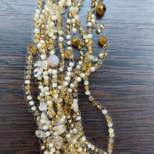 Beige small delicate layered necklace made of beads with citrine