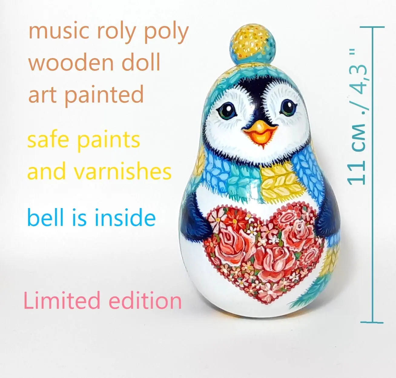 A cute penguin with a heart of roses . Roly poly toy