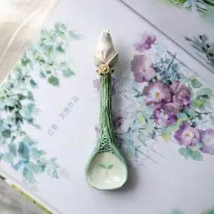 Enchanting decorative ceramic spoon with white rabbit and roses on top