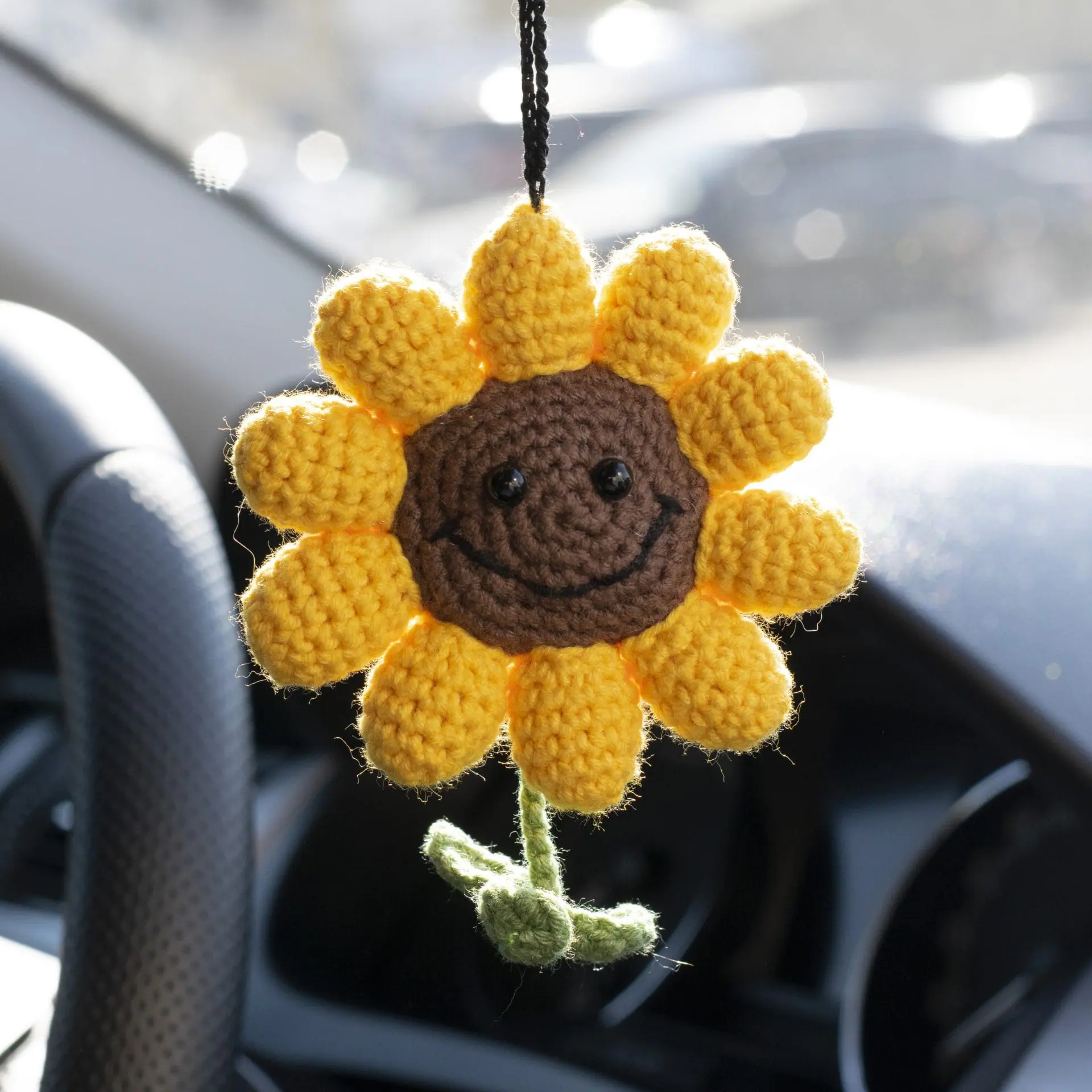 Crocheted sunflower charm car accessory on the rearview mirror 1 Crocheted sunflower car charm on the rearview mirror