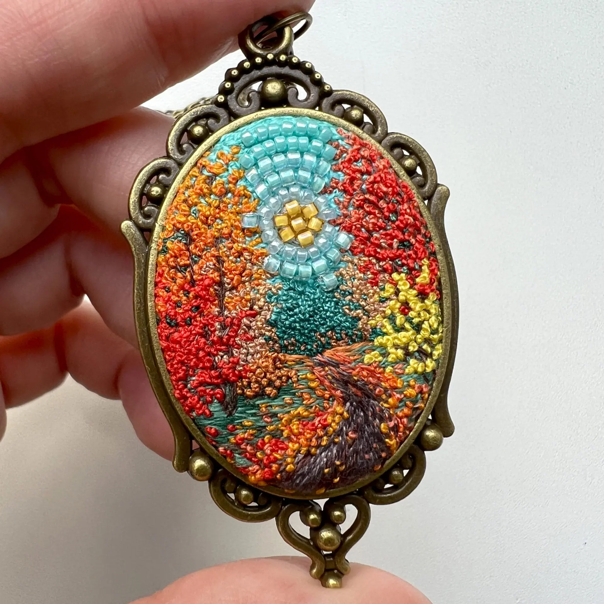 New Journey Ahead, landscape embroidery pendant