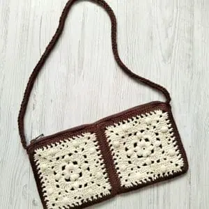 Crochet makeup bag granny square pattern with zipper and lining includes: instructions, photos, diagram, video, different ways to joins squares and 3 ways to crochet handles.